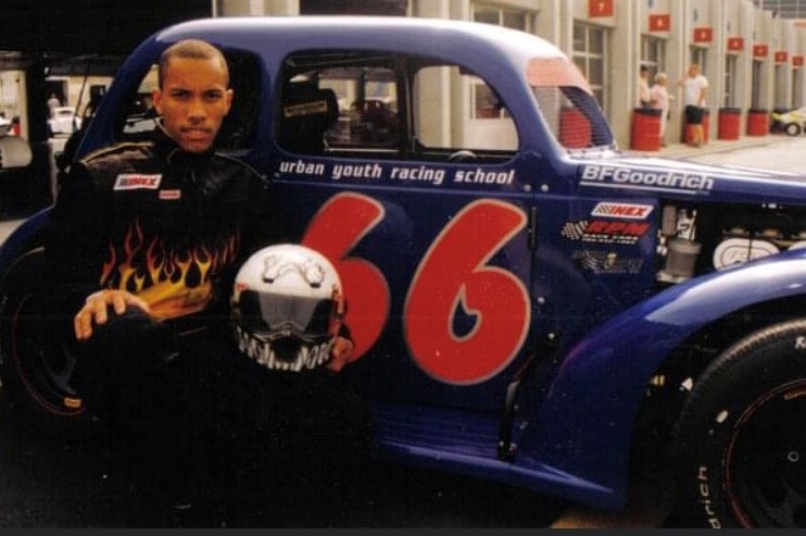 Jason Simmons, UYRS alumnus, with the #66 Urban Youth Racing School car
