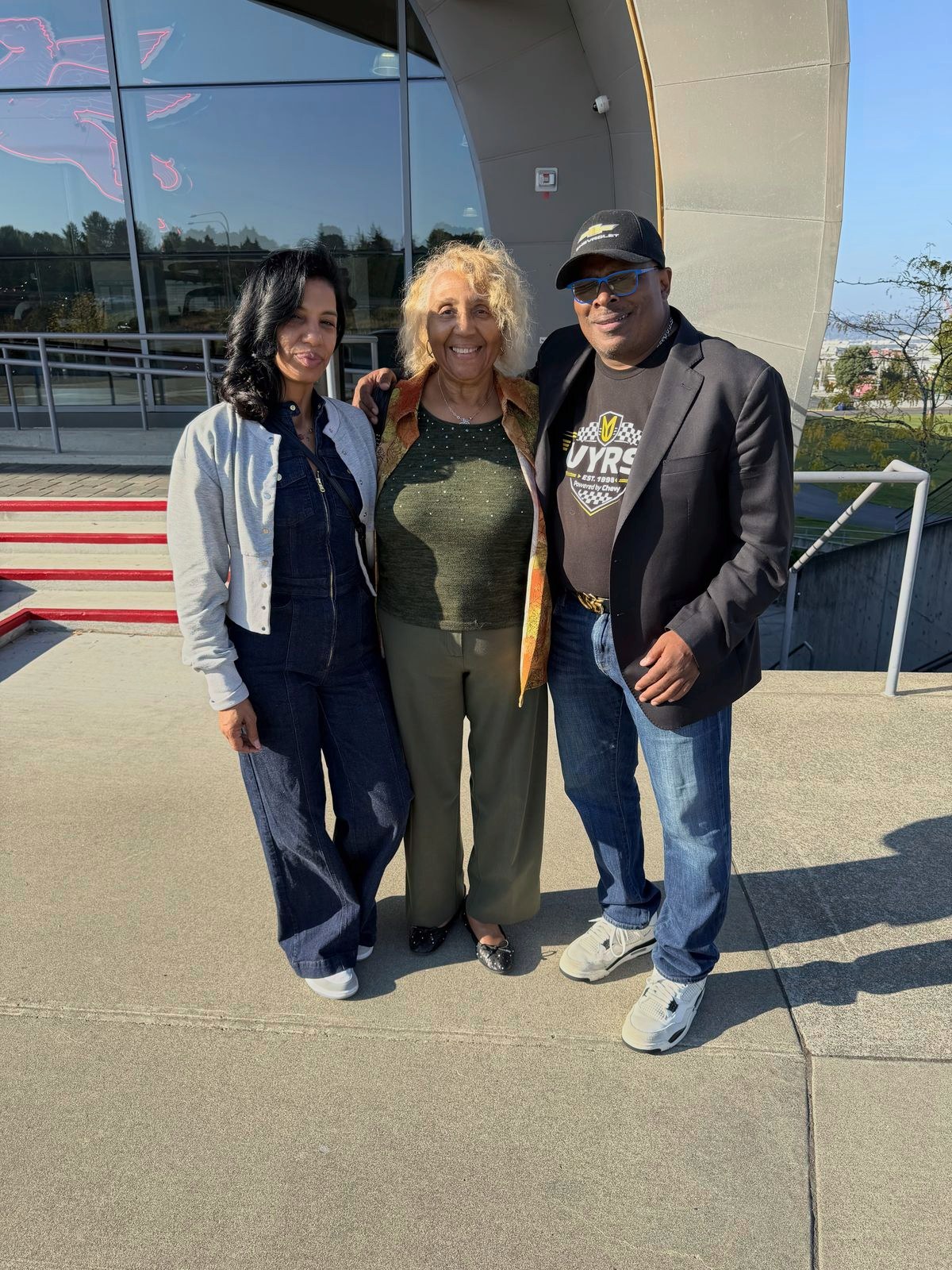 Michelle Martin, Angi Rogers (Charlie Wiggins’ niece) and Anthony Martin outside LeMay – America’s Car Museum.