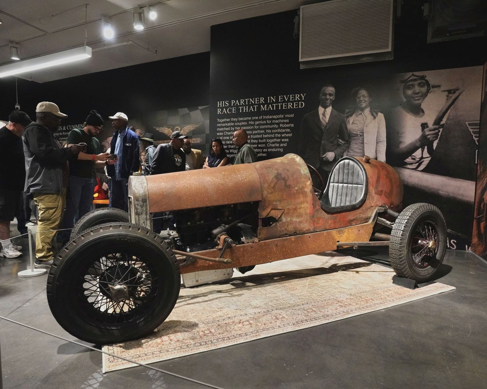 Guests gather around the 1925 Wiggins Special on opening night.