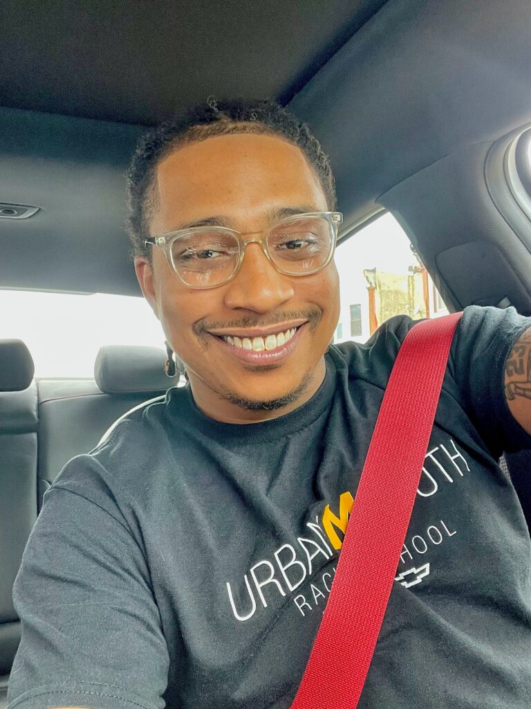 Terron Martin, STEM Program Manager at Urban Youth Racing School, with a diverse background in Business Management, Music Production, Audio Engineering, and Mechanical Engineering, dedicated to inspiring and educating students.